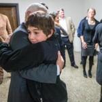Suffolk District Attorney Daniel Conley hugged Richard Nunez, 13, after Eldrick Broom was convicted Friday of killing Nunez’s mother.